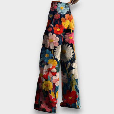 Talira – Wide-Leg Trousers with Floral Essence